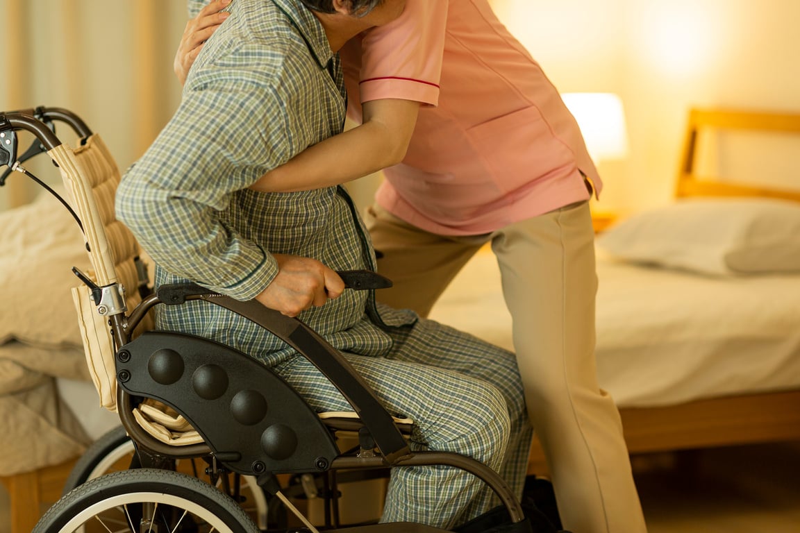 Carer caring for senior man