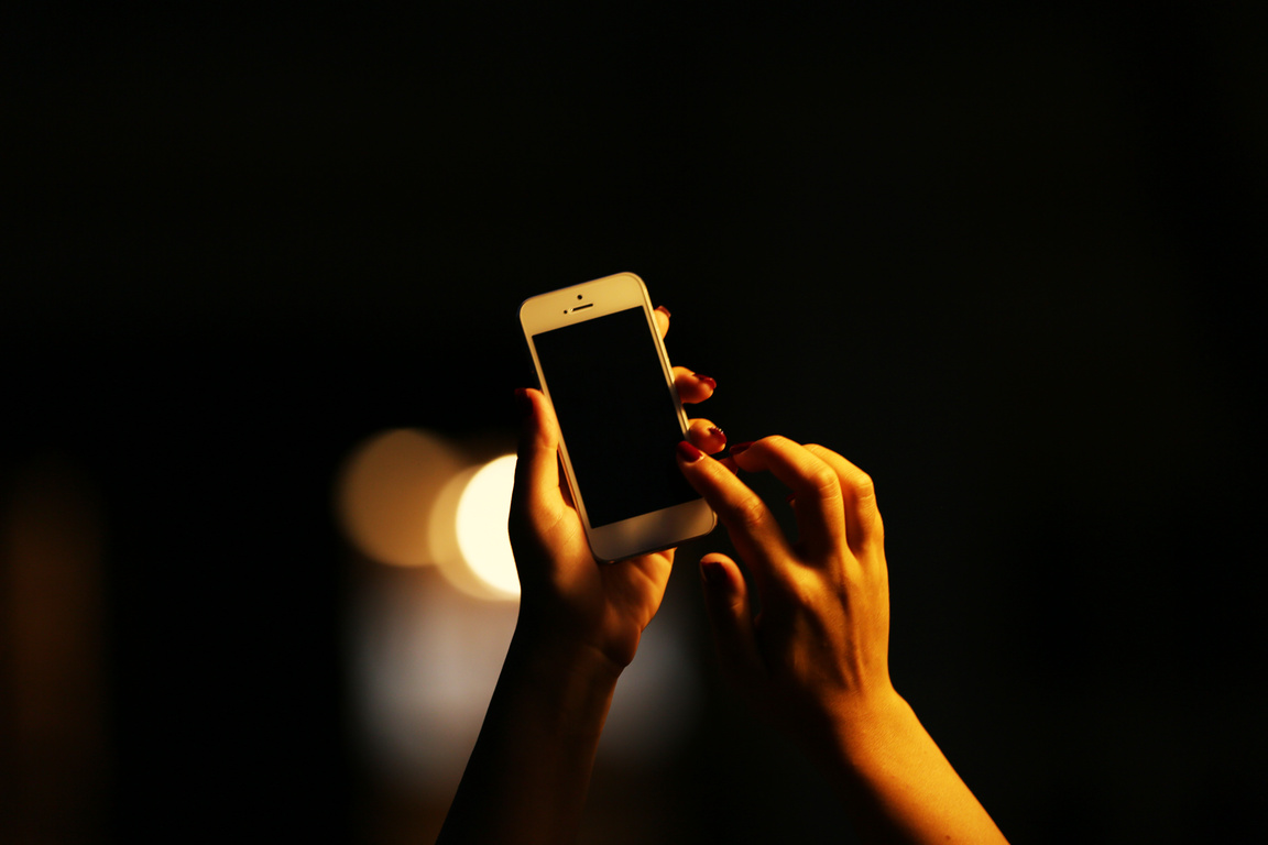 Woman Using a Smartphone in the Dark